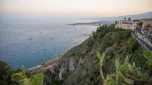 set-jetting travel guide 2026, Taormina Sicily White Lotus filming location aerial view