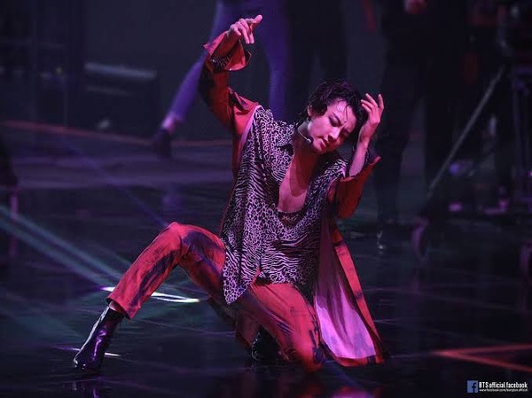 K-Pop Singer Jungkook performing "My Time" live on stage.