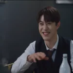 Han-seo smiling, Representing the Theme of Sacrifice in Vincenzo.