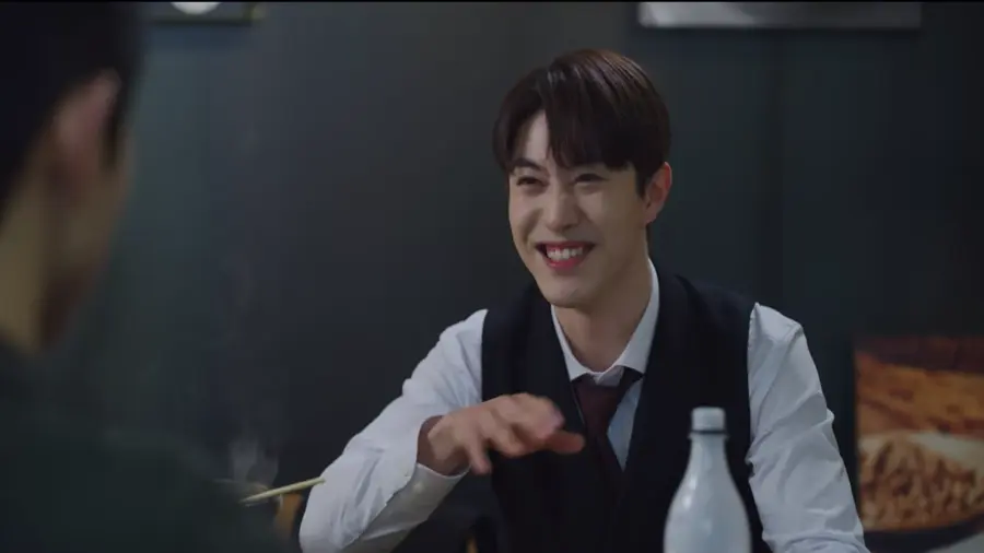 Han-seo smiling, Representing the Theme of Sacrifice in Vincenzo.