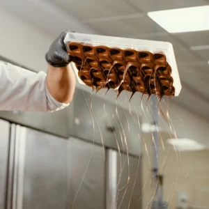 A Chocolatier Handcrafting a Chocolate at Smoorland Bangalore.