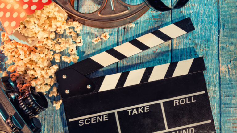 A film clapperboard and reel representing actor Abhirup Chakraborty’s journey in cinema and advertisements.