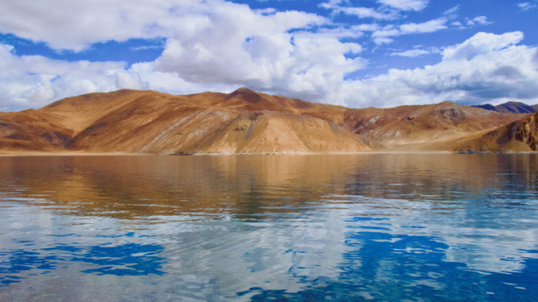 Ladakh-monsoon-travel-guide-2026-—-Pangong-Lake-clear-blue-sky-snowcapped-mountains