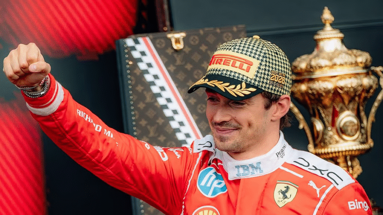 Charles Leclerc celebrates with the winner's trophy after securing a dramatic British Grand Prix victory at Silverstone, marking Ferrari's 250th Formula One Grand Prix win.