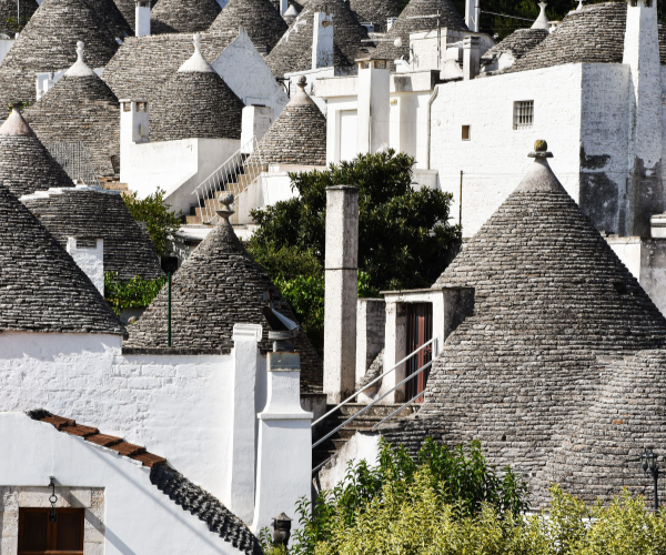 Slow travel Italy in the trulli houses of Alberobello, Puglia.
