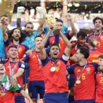 Rodri of Spain celebrates with the World Cup trophy alongside teammates after Spain's victory over Argentina in the FIFA World Cup 2026 final.