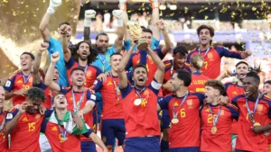 Rodri of Spain celebrates with the World Cup trophy alongside teammates after Spain's victory over Argentina in the FIFA World Cup 2026 final.