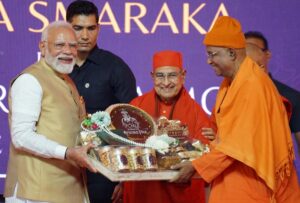 PM Narendra Modi receives a traditional honour during the event.