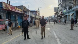 Police officers inspect the site of a suicide bombing in Kabal, Swat Valley, Pakistan.
