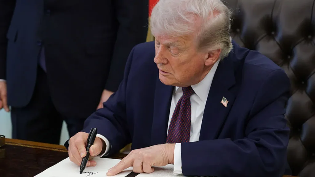 President Donald Trump signs an executive order to secure the US power grid.