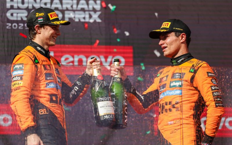 Budapest, HUNGARY – AUGUST 3: Oscar Piastri of Australia and McLaren F1 Team and Lando Norris of Great Britain and McLaren F1 Team celebrate on the podium during the F1 Grand Prix of Hungary at Hungaroring on August 3, 2025 in Budapest, Hungary. (Photo b Lando Norris and Oscar Piastri celebrate their 1-2 finish on the podium (F1)
